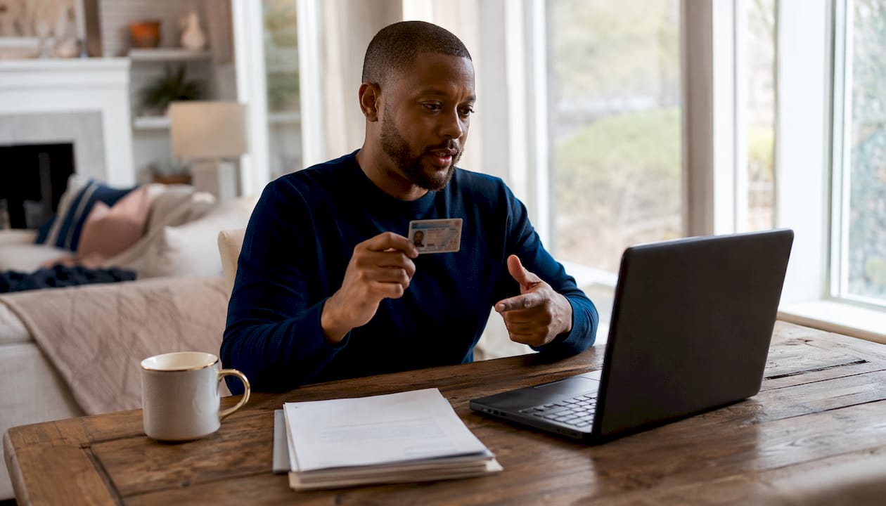 Man participating in remote online notarization at home