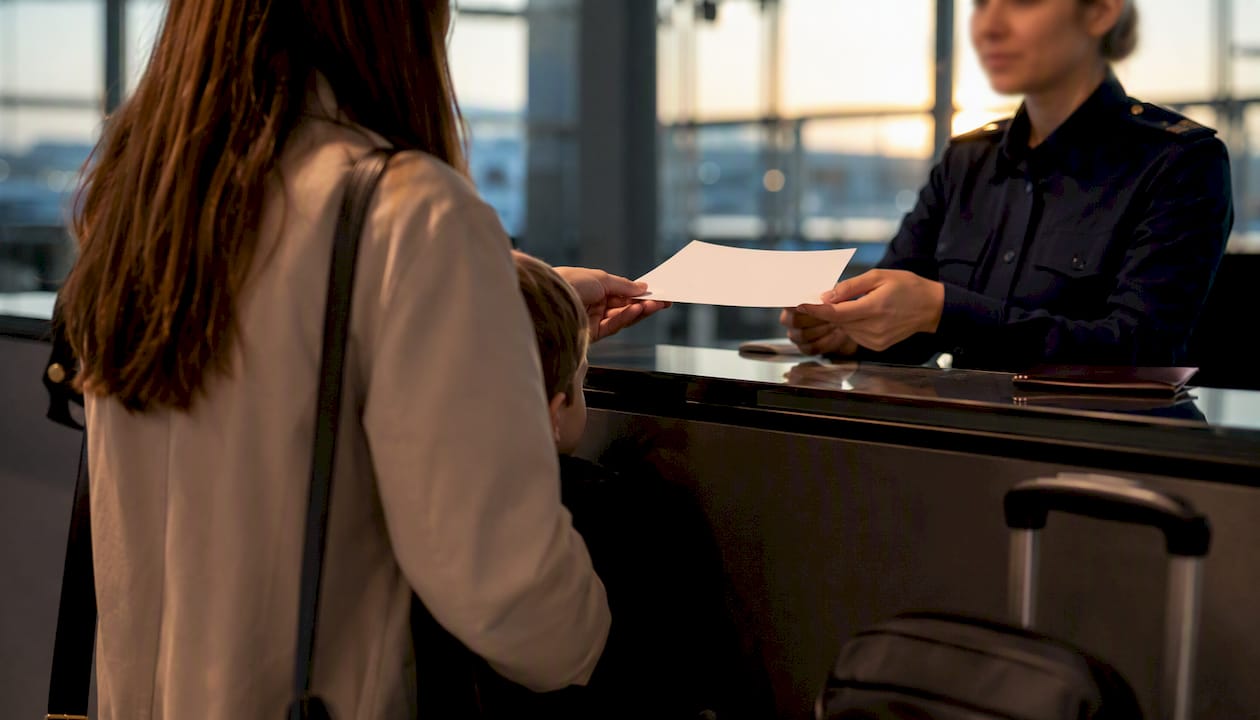 Traveler presenting consent document at border control