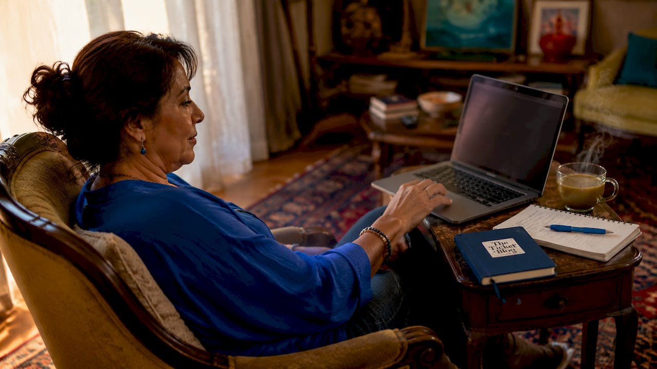 Woman browsing Broadway tickets at laptop
