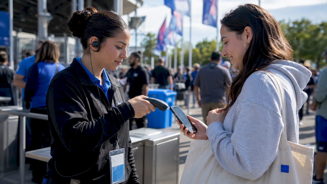 Staff scanning ticket barcode at event entry