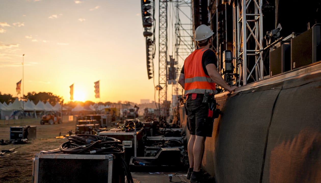Technician inspecting festival main stage scaffolding