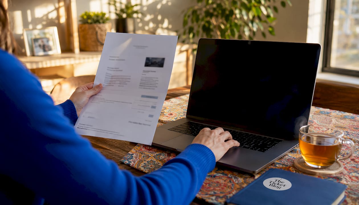 Hands confirming ticket cashback tracking