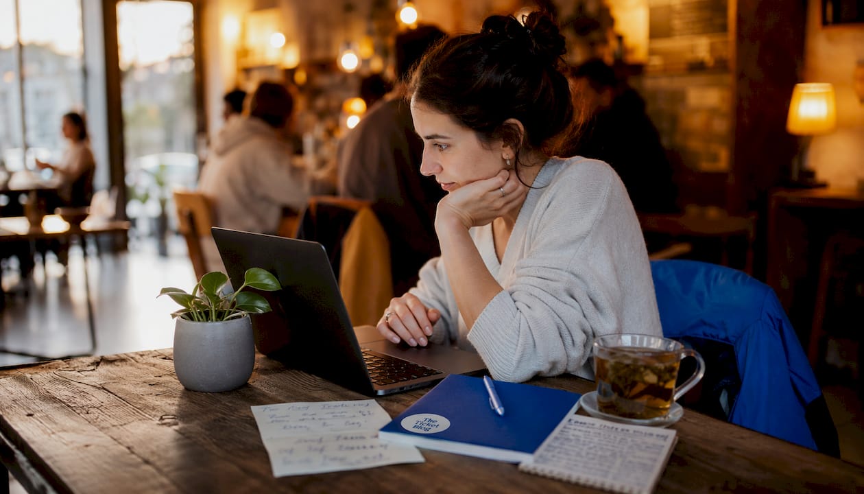 Woman buying tickets online at home