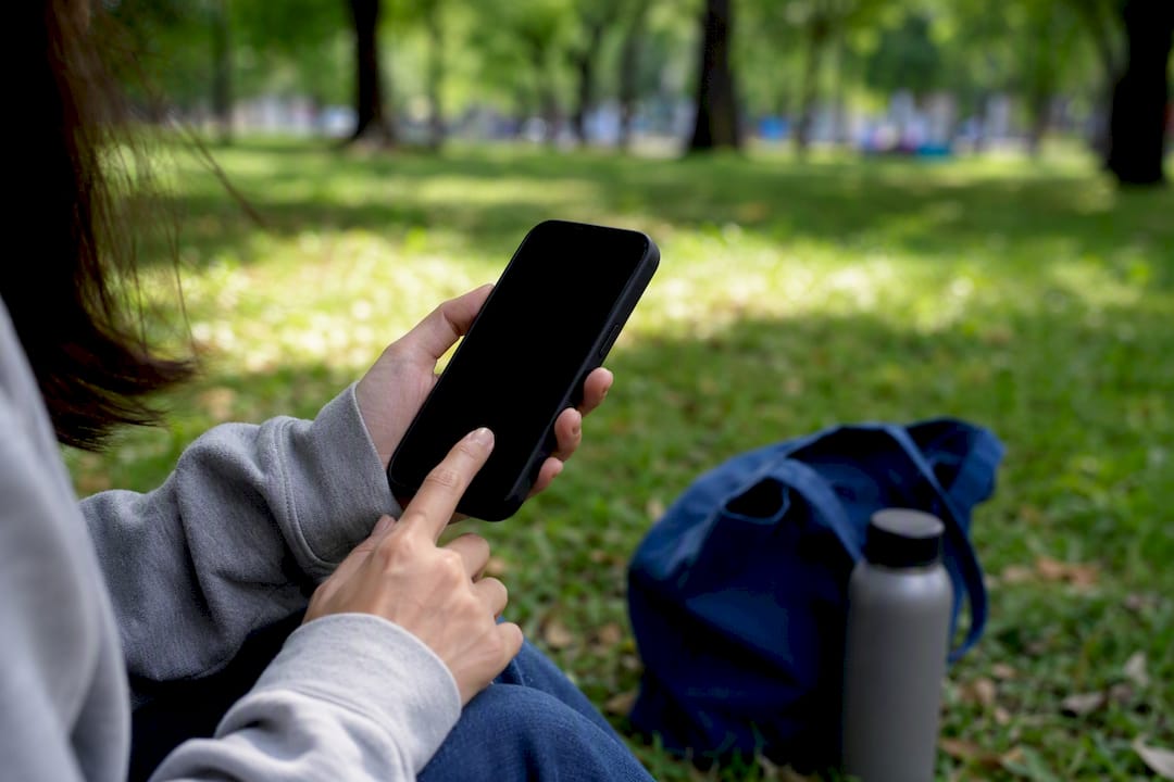 Hands downloading instant tickets on phone