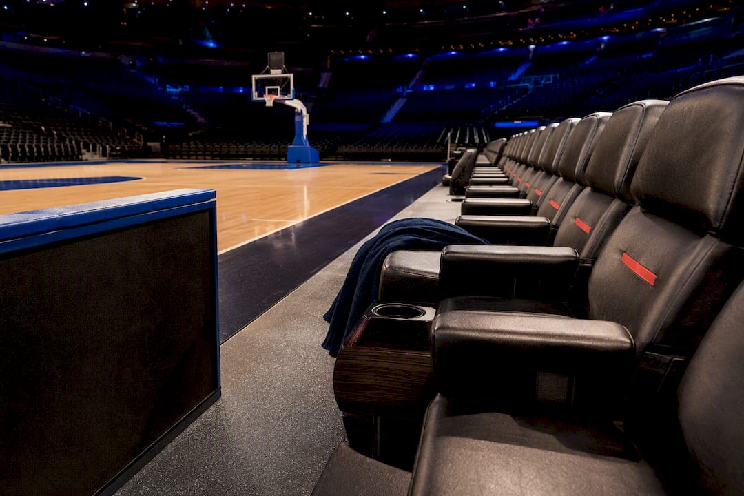 Premium courtside seats beside arena floor