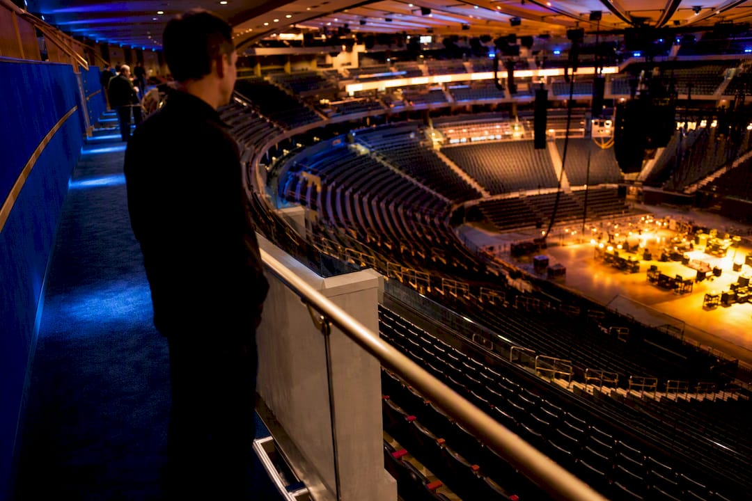 View across arena seating tiers toward floor