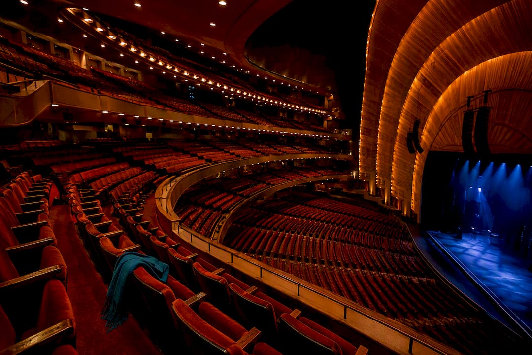 Tiered theater seating viewed toward the stage