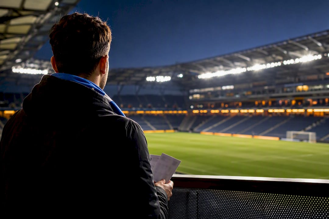 Fan considering tickets outside soccer stadium