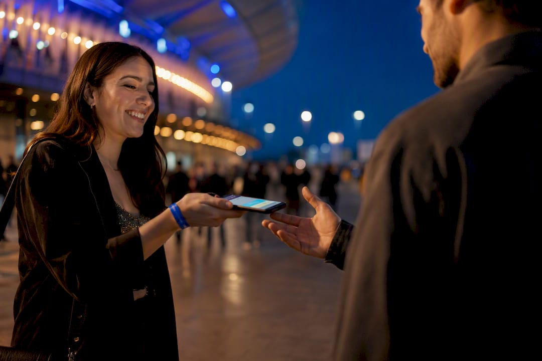 Fans completing a digital ticket handoff