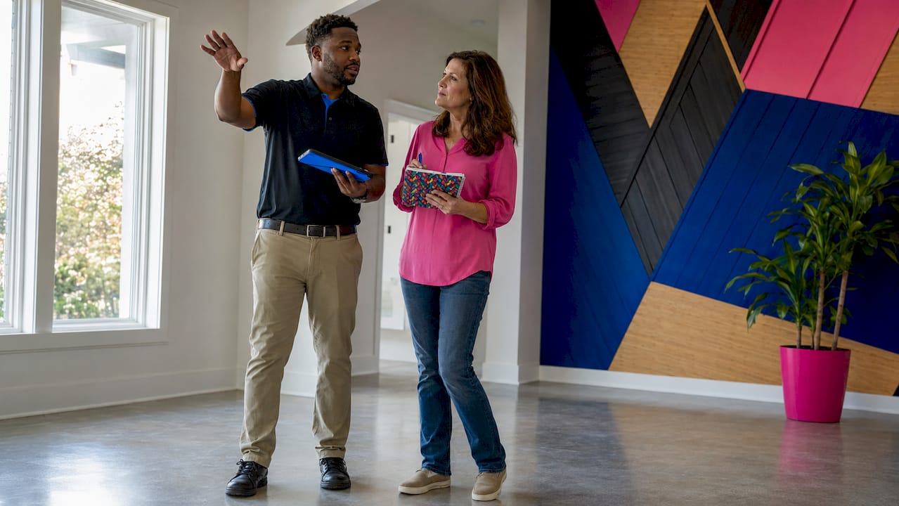 Contractor conducting home walkthrough with homeowner
