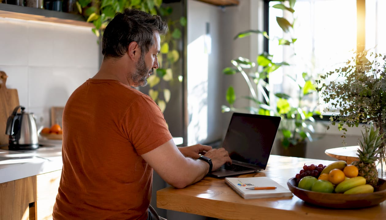 Hands typing captions for NDIS video content