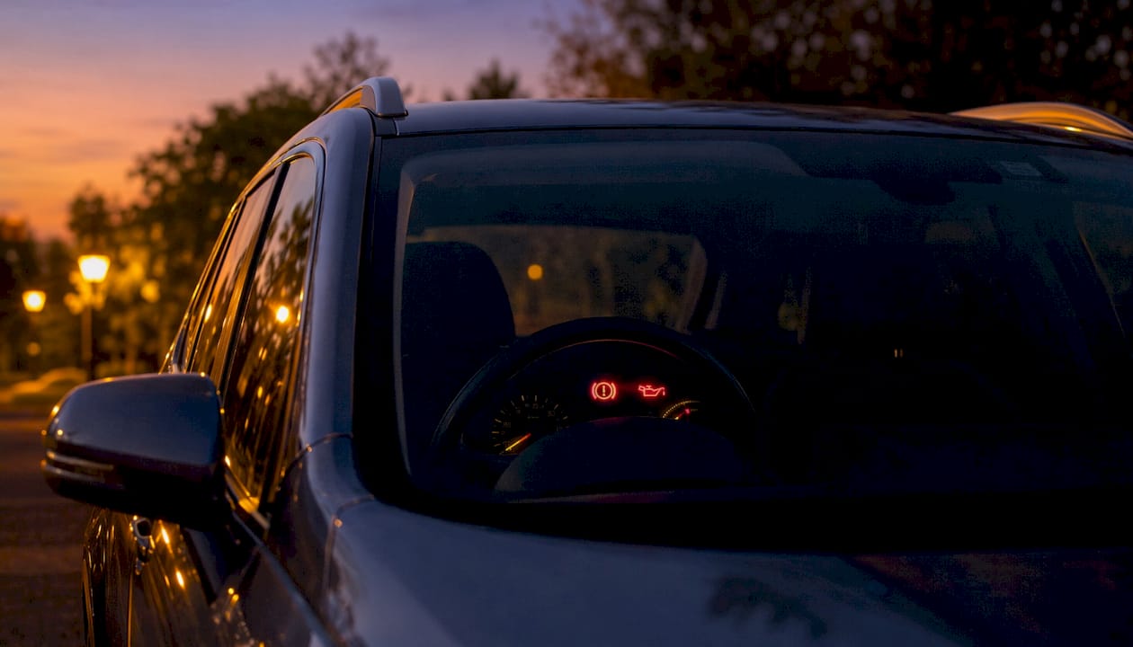 Illuminated dashboard warning lights inside car