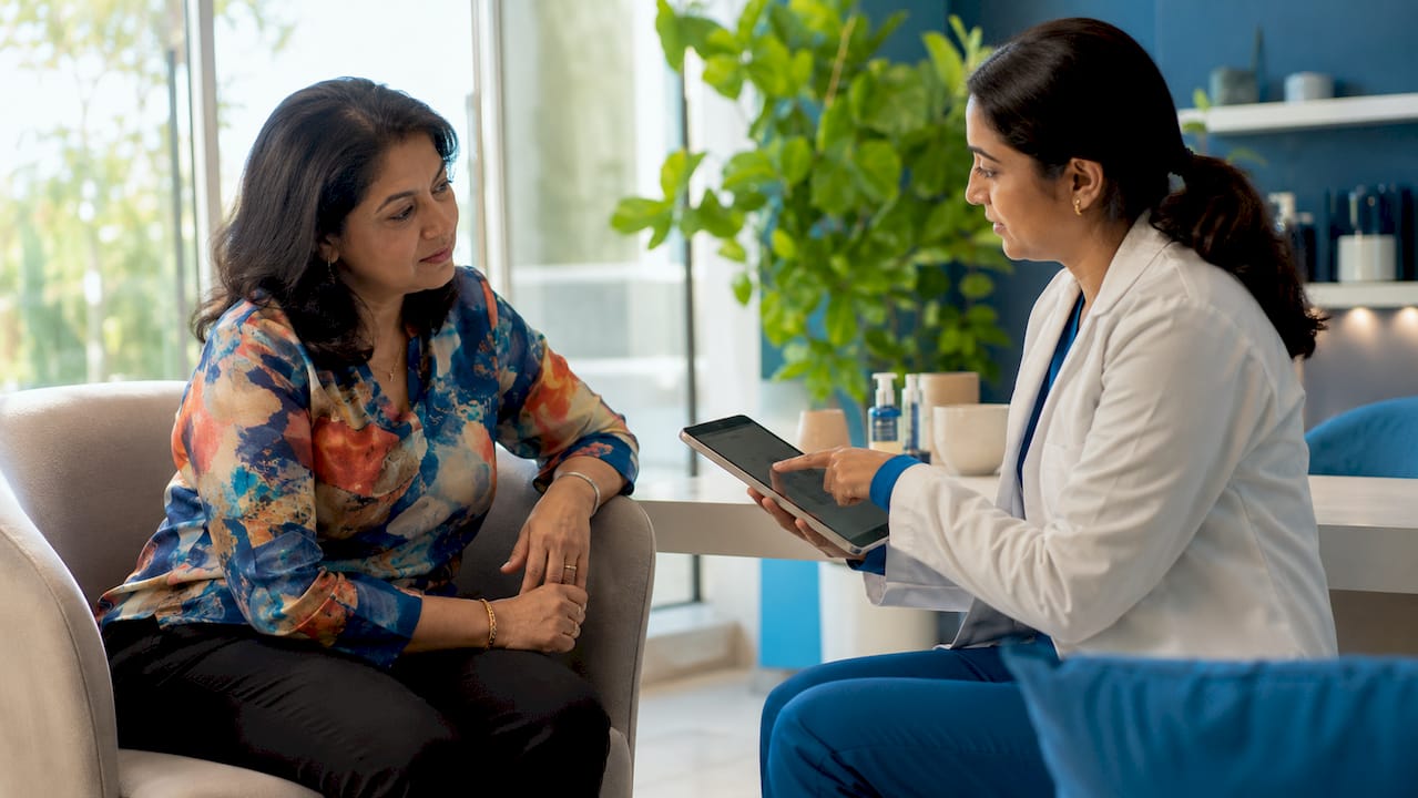 Patient consulting dermatologist on skin treatments