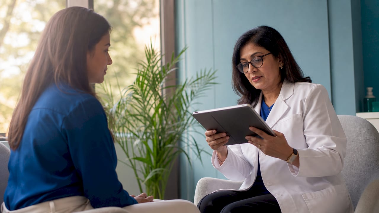 Dermatologist consulting with patient about laser treatment