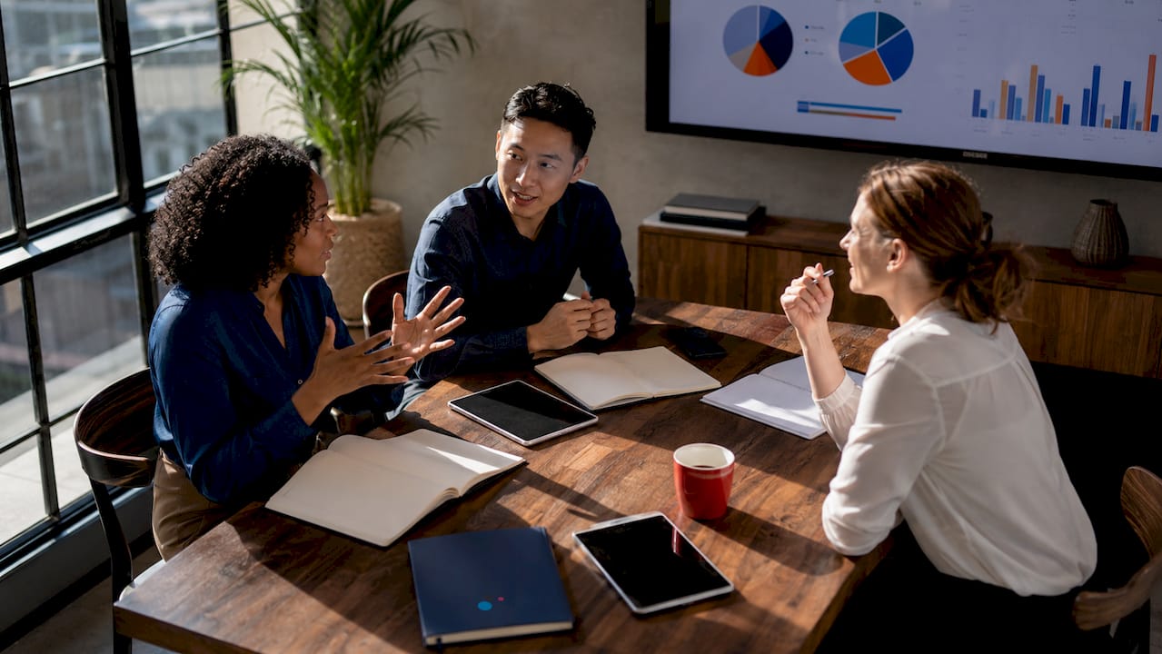 Diverse team strategizing Google Ads campaign