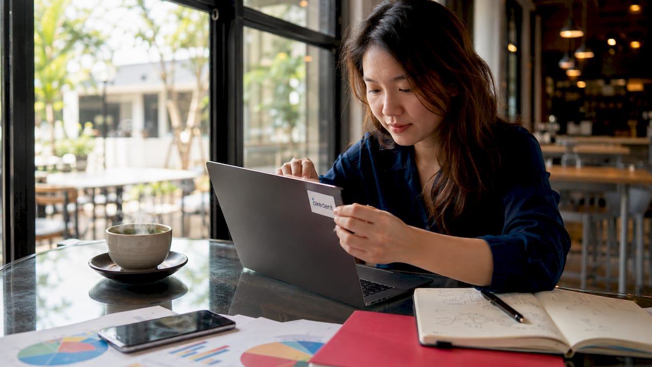 Woman placing Google Ads tag on laptop