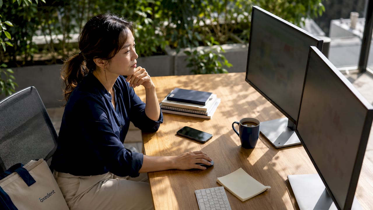 Expert managing Google Ads campaigns at desk