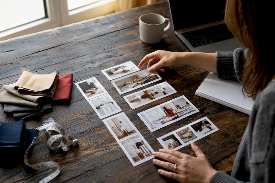 Hands sorting photos of different image ratios