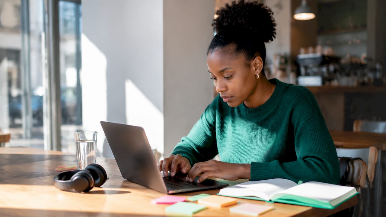 Customer agent typing in home office setup