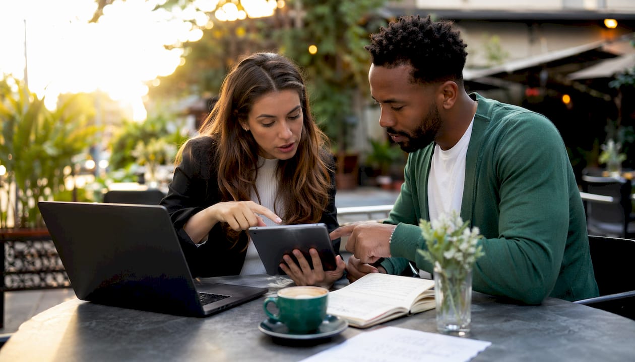 Two professionals planning WhatsApp group strategies