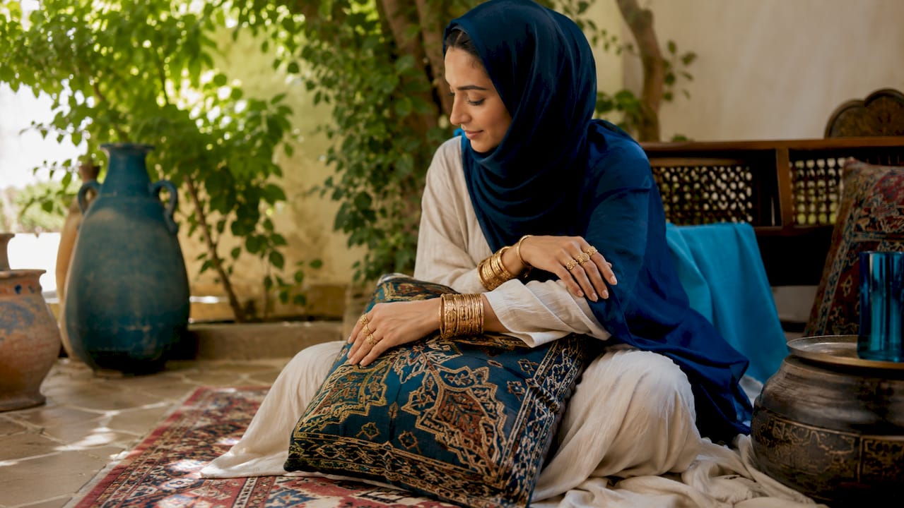 Muslim woman’s gold jewelry close-up