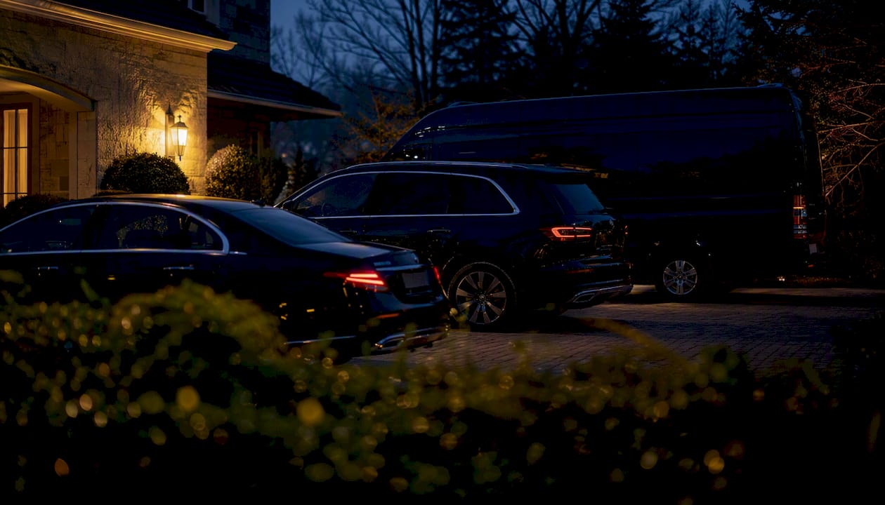 Silhouettes of executive transport vehicles at dusk