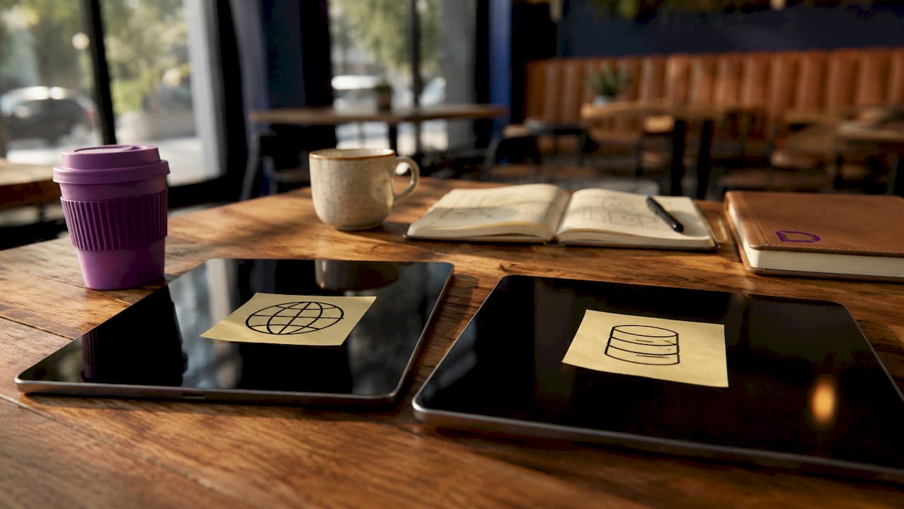 Tablets with static and database icons on desk