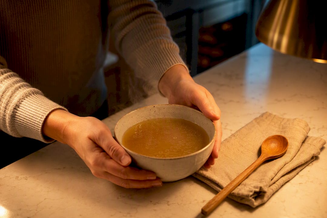 Warm bone broth served before bed