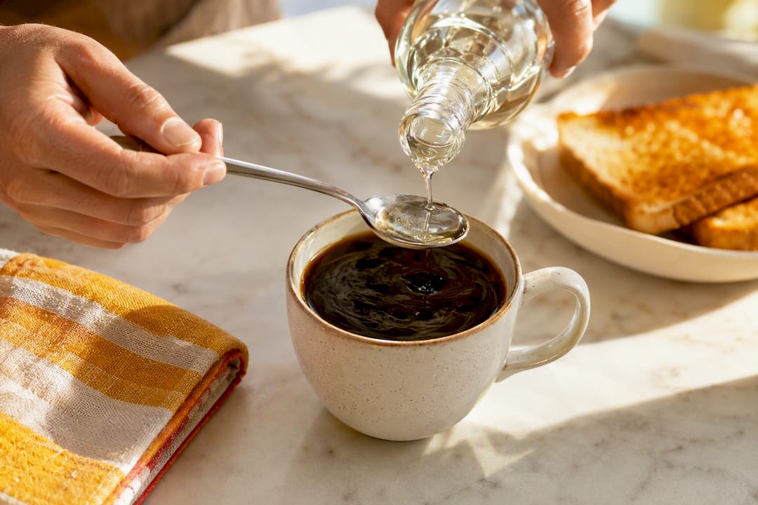 MCT oil being added to coffee