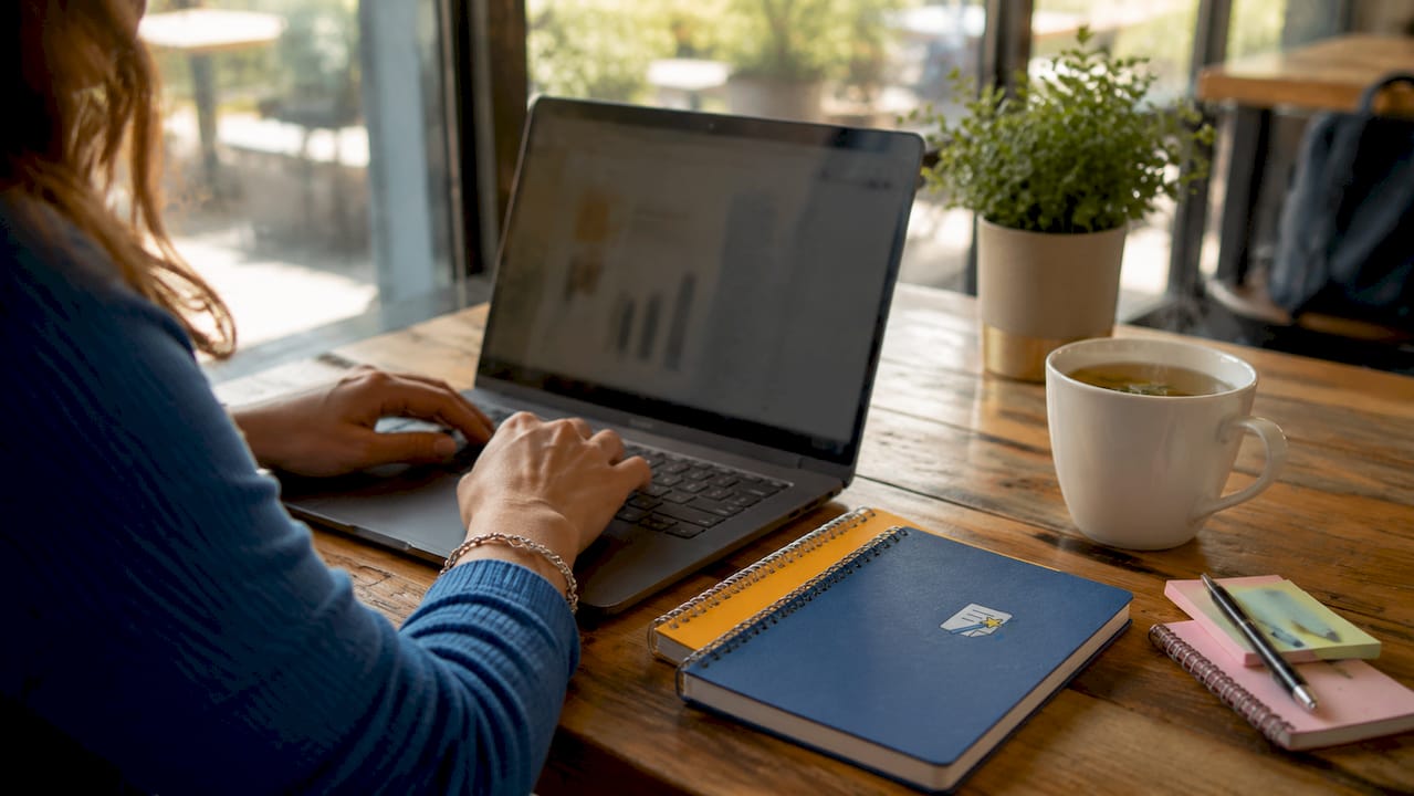 Hands typing worksheet layout in word processor