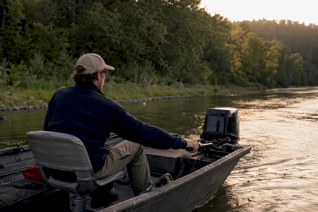Boat operator adjusting drift speed on river