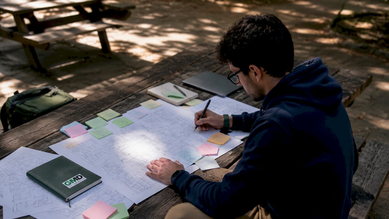 Man redesigning AI workflow on sketches