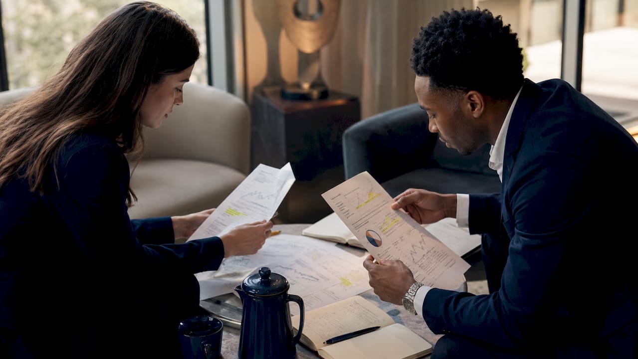 Group reviewing crypto securities risk charts