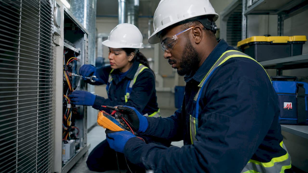 Technicians conducting preventive HVAC maintenance