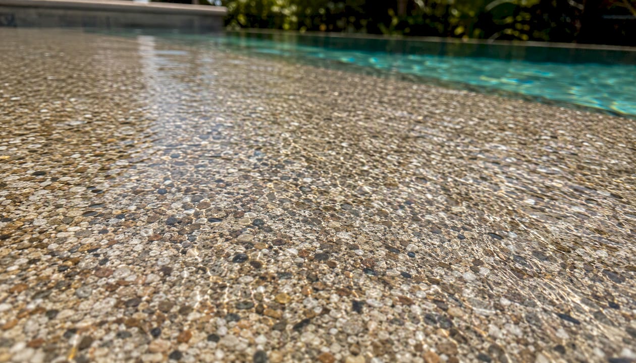 Close-up of quartz pool finish texture and color