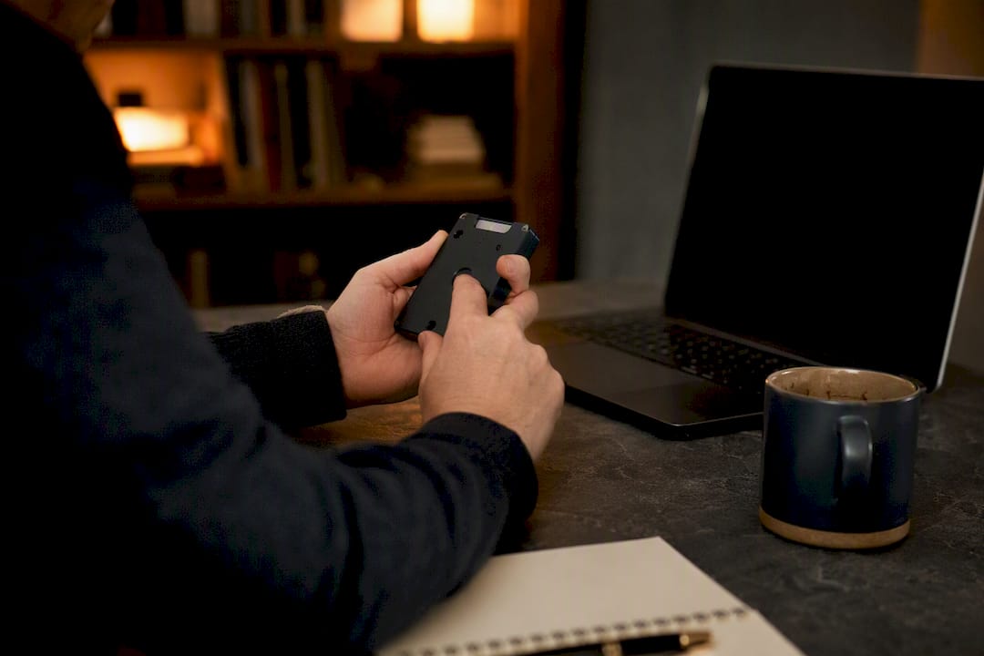 Hands attempting crypto withdrawal on hardware wallet