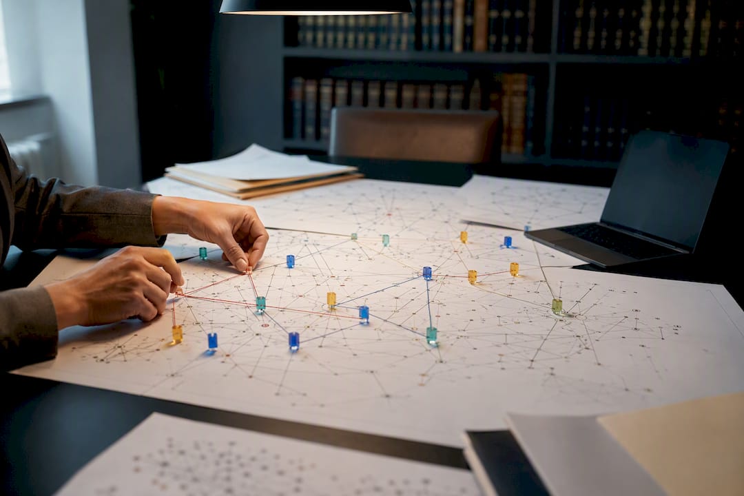 Hands tracing blockchain transaction graph