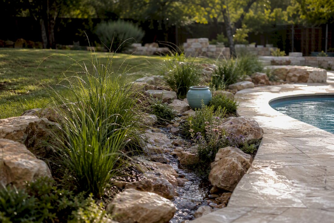 Landscaped swale beside pool terrace
