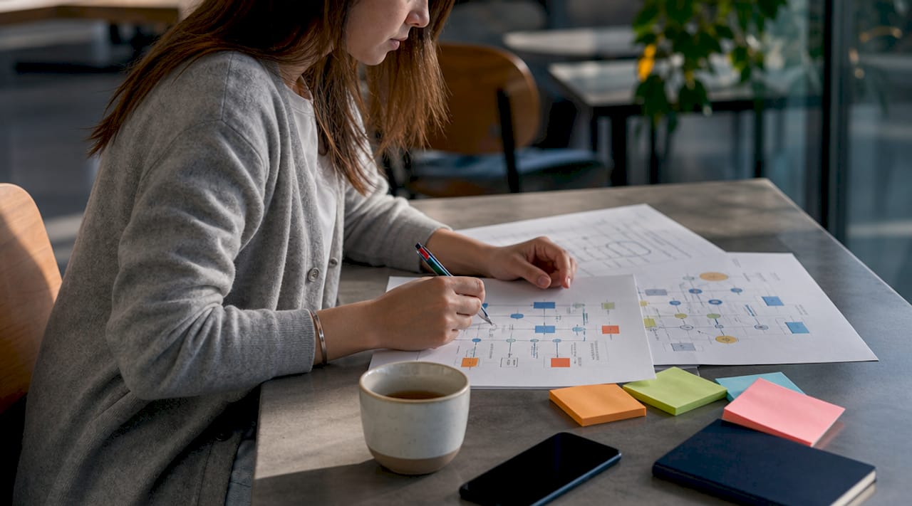 Hands reviewing AI transport implementation timeline documents