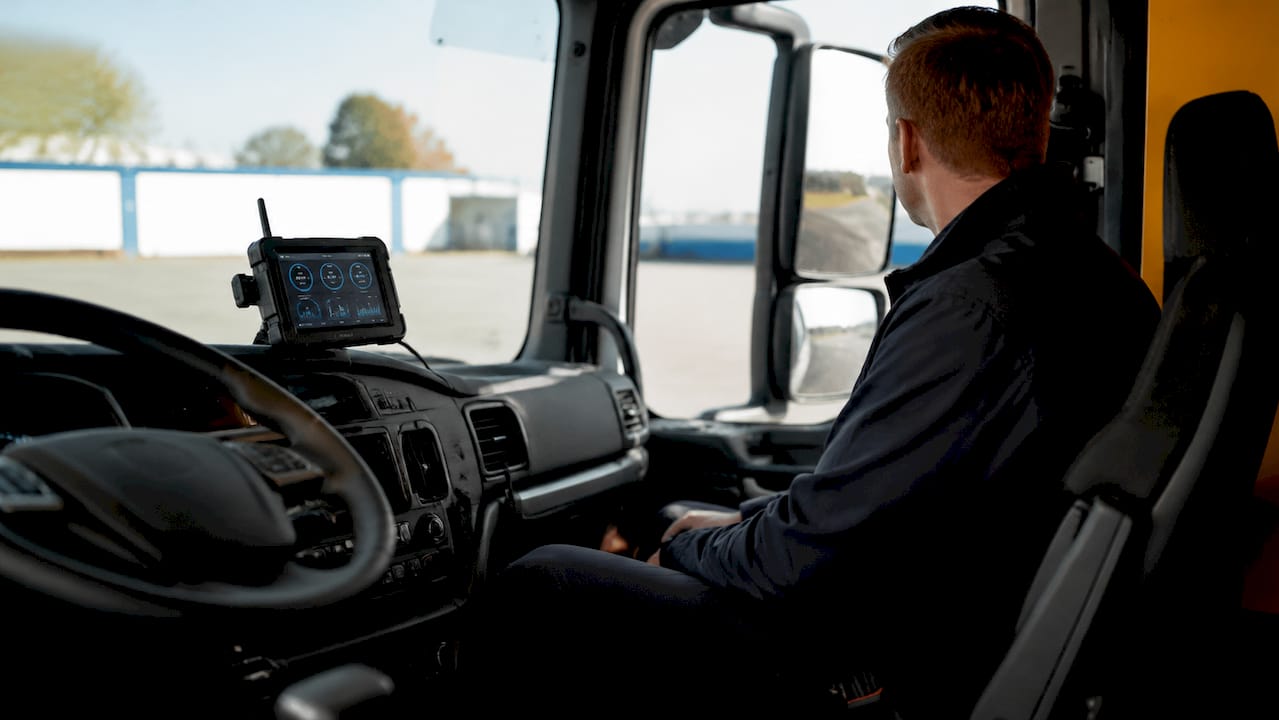 Telematics device in truck cabin showing operational metric