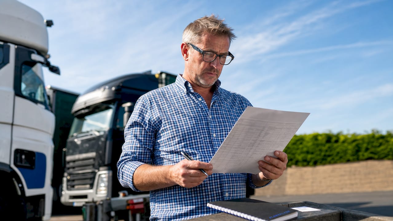 Logistics manager reviewing HGV payload compliance documents