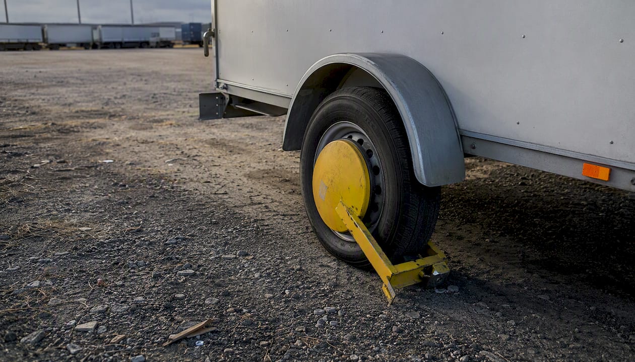 Wheel immobiliser boot fitted on trailer wheel