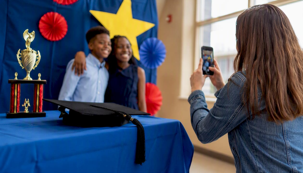 Photo station with graduation cap and trophy