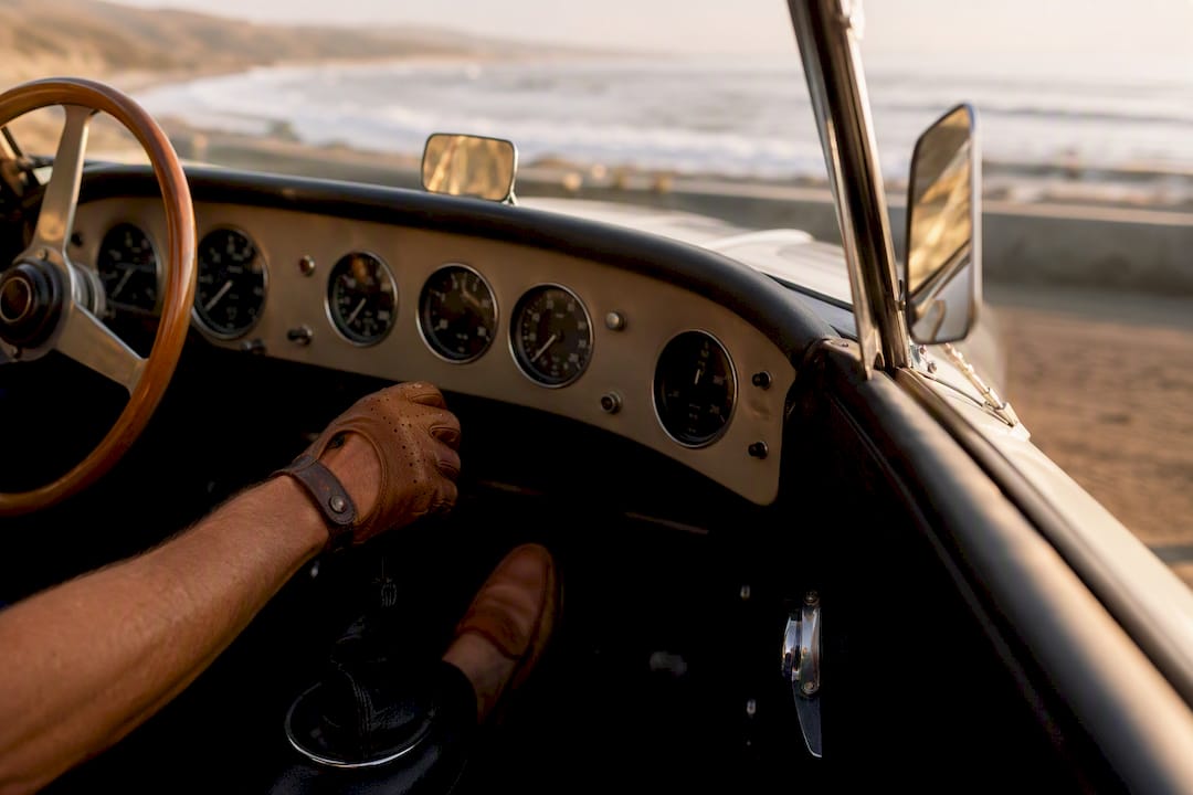 Hand shifting gear during vintage truck test drive