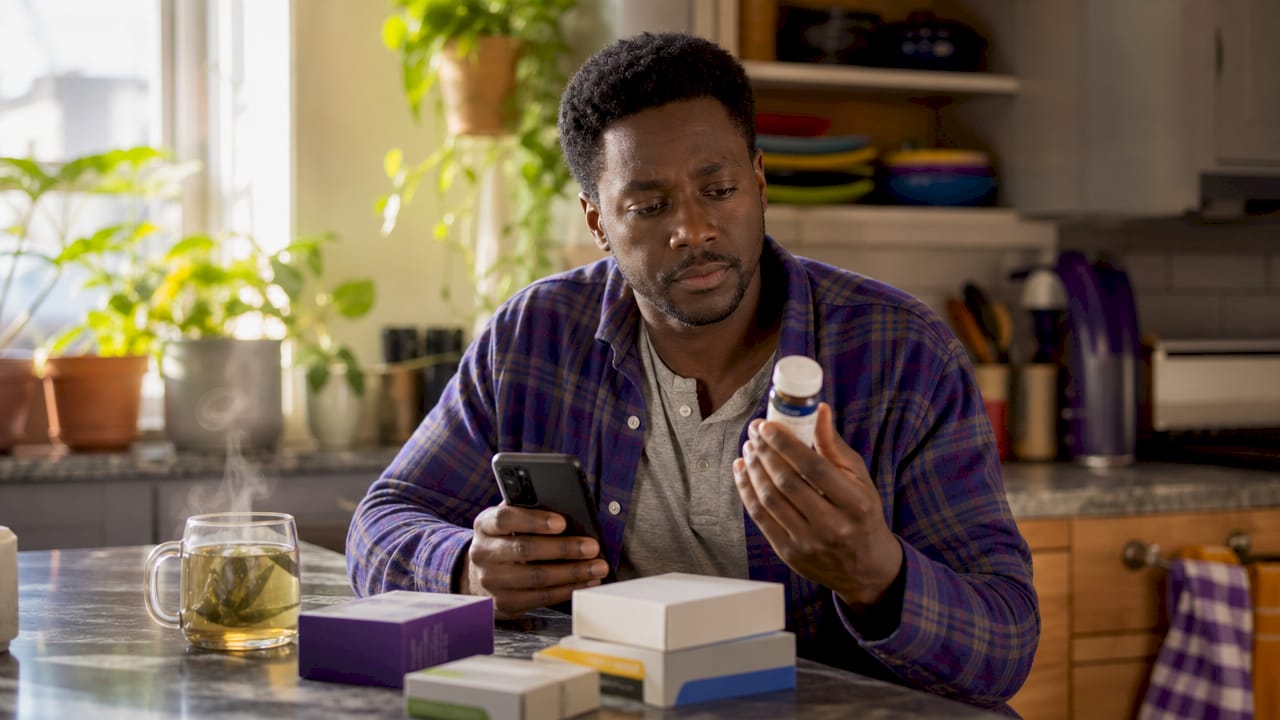 Man checking insulin supplies and phone
