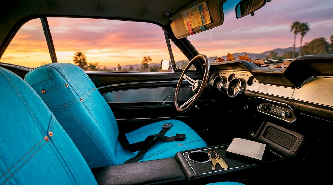 Close-up of classic car interior with denim details