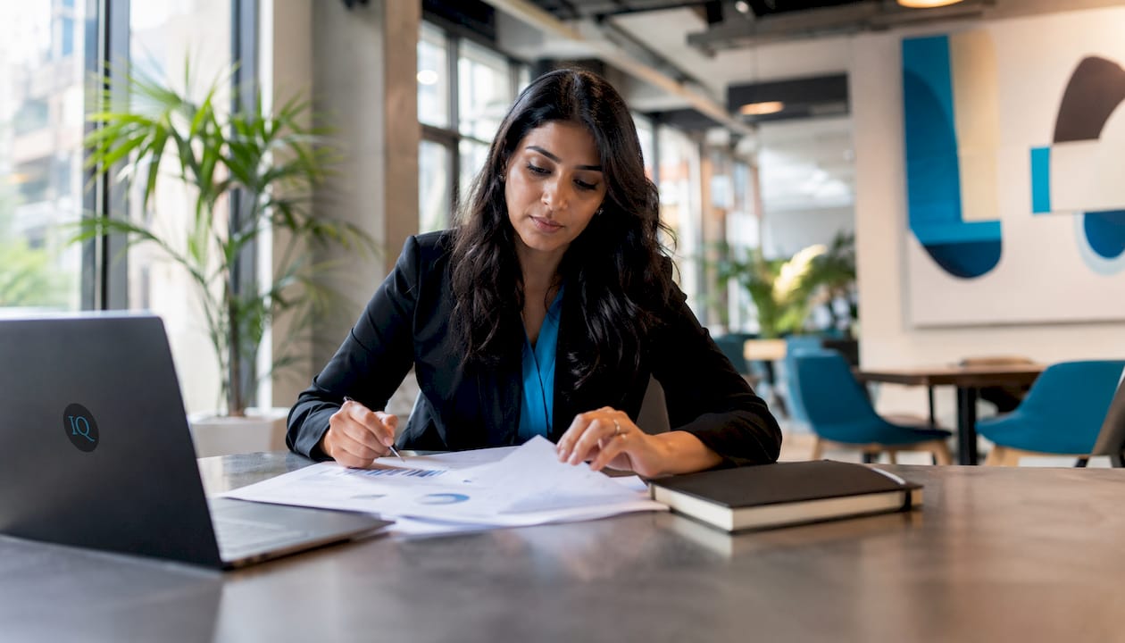 Strategist working on AI-driven planning at office desk