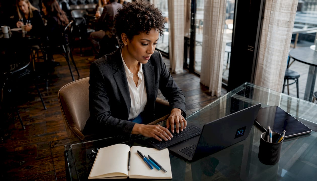 Entrepreneur typing business plan in home office