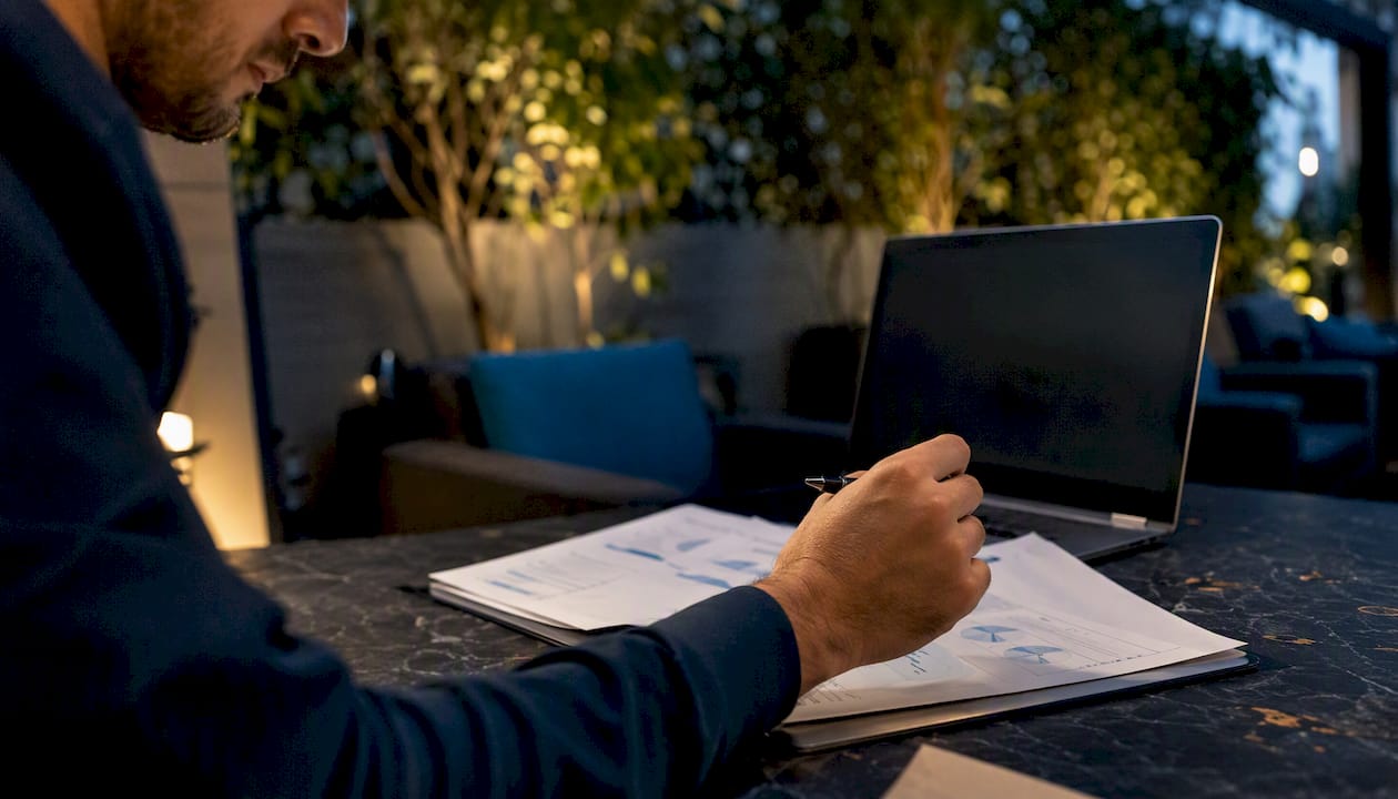 Hand pointing at data charts in analysis