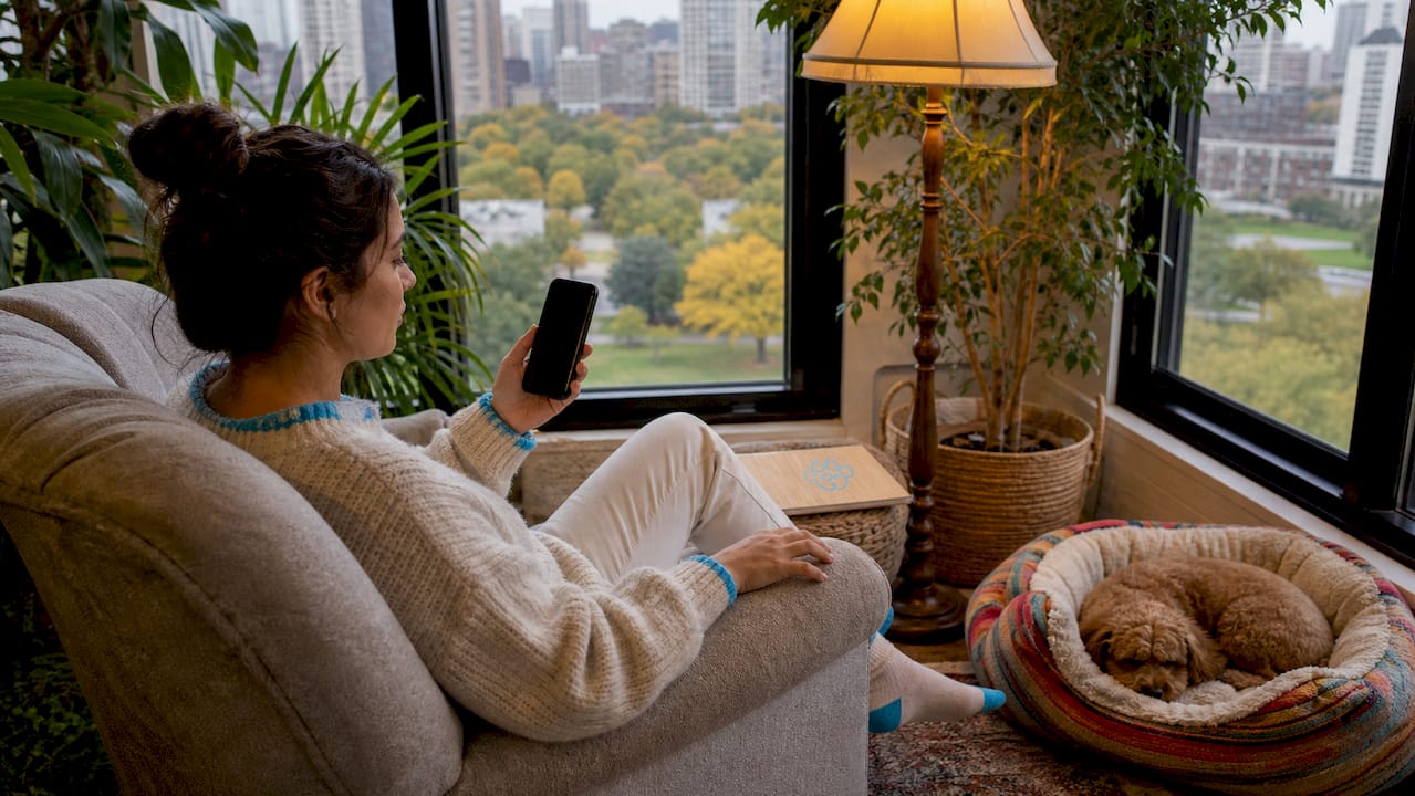 Urban pet owner checking pet app on smartphone